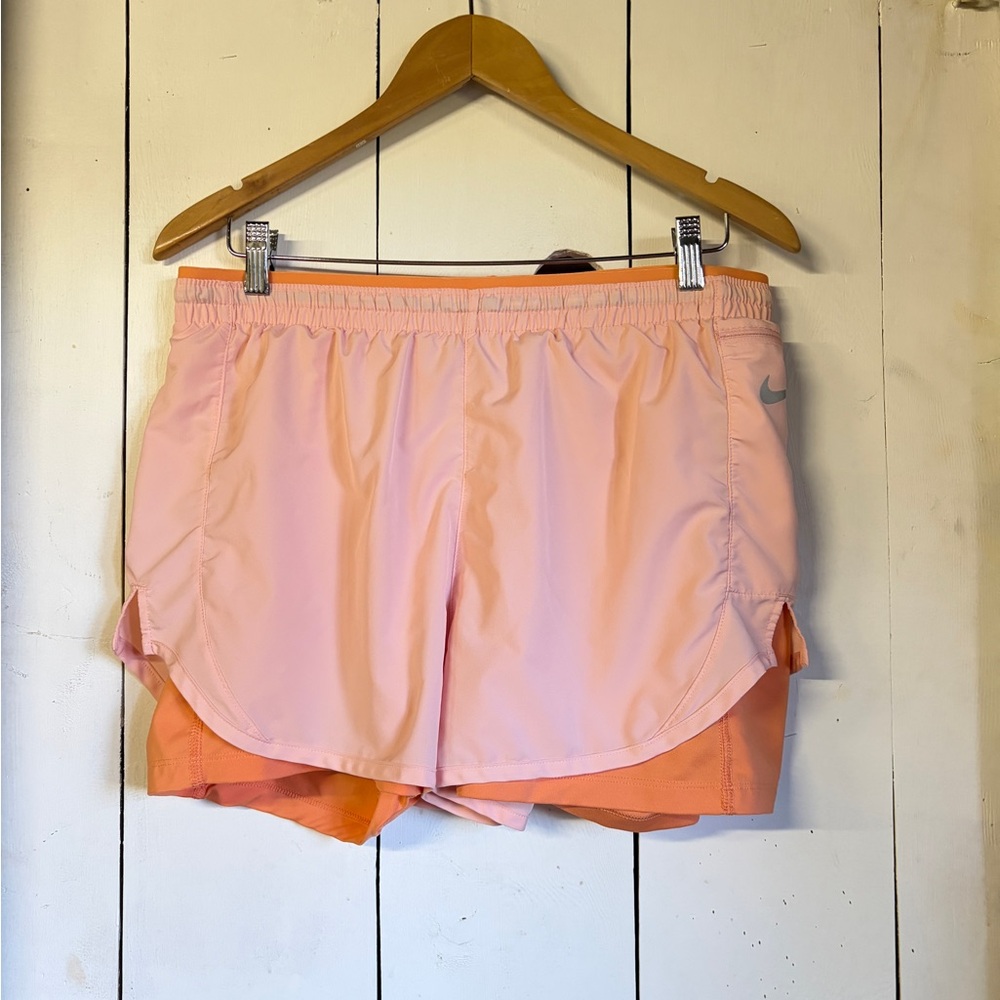 Nike Women's Athletic Shorts in Pink and Orange, size large, lots of pockets